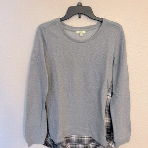 Women’s long sleeve gray top size small. Part of the shirt is plaid in the back.
